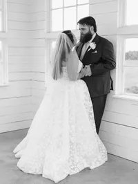 Man and wife gazing into each others eyes after being married