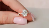 Custom diamond engagement ring with pear-shaped center stone