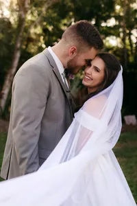 Bride and groom sharing a warm hug during their St. Augustine wedding.