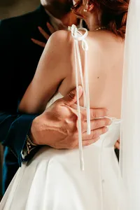 Close-up of bride and groom holding each other lovingly during their St. Augustine wedding.