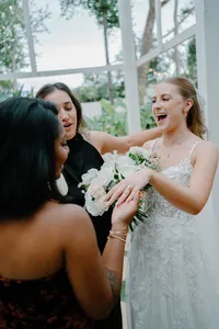 bride shwoig off her ring to her guest at the wedding the Julliana