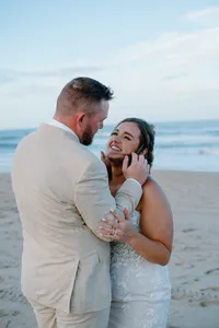 groom brushing his thumb against brides face