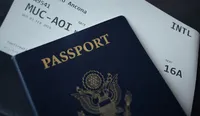 US passport with Munich to Ancona boarding passes for an Italy journey