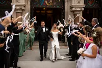 Bride and groom waving with their guests at One North Broad in Philadelphia, Pennsylvania