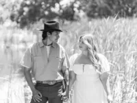 Black and white photo of a couple posing for a romantic summer engagement portrait in Orange County.