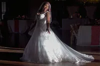 Venice Beach Los Angeles wedding photography of the bride dancing in the dark with cinematic lighting, captured in a fun documentary moment and true to life color.