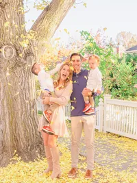 Family portrait with kids and leaves
