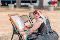 Emotional moment of a bride looks at the portrait of her mom's wedding