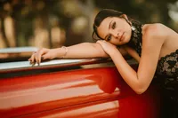 nior portrait at Triple T Farms in Fruitdale, Alabama — vintage red truck