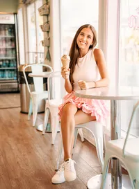 Senior portrait in Gulf Shores, Alabama — inside TCBY yogurt shop holding an ice cream cone
with sprinkles.