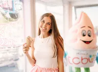 Senior portrait in Gulf Shores, Alabama — holding her ice cream cone by the window inside
TCBY.