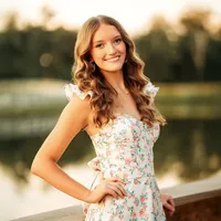 Senior girl posing near a pond at The Oaks at Magnolia Springs Alabama.