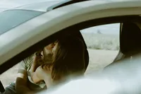engagement shoot, couple sitting inside a car cuddling, Sunshine Coast
