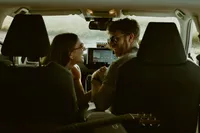 engagement shoot, couple sitting inside a car cuddling, Sunshine Coast