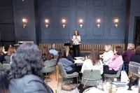 Employees participating in an interactive workplace workshop focused on time management and sustainable productivity.