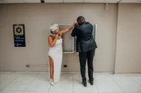 City Hall Couple Plays on Payphones