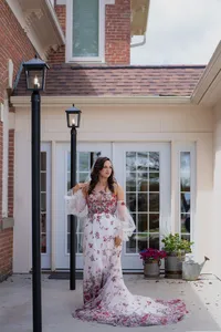Kalon studio red floral non-traditional dress at Iowa wedding venue french doors