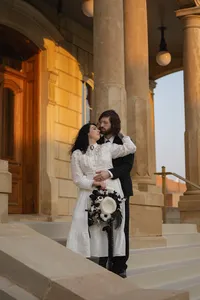 Victorian Themed Elopement at Winterset Courthouse bride and groom in period correct attire with vintage hat non-traditional wedding