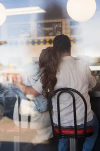 Non-traditional couple engagement at waffle house scottsdale arizona hugging