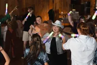Iowa Wedding western non-traditional alternative bride with cowgirl hat at reception dancing and singing