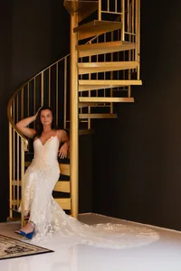 The Prelude old money bride at gold spiral staircase Iowa wedding