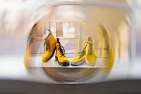 Omaha Nebraska wedding details non-traditional yellow wedding boots and sneakers at hotel venue
