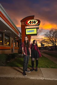 Iowa Alt Photographer for alt baddie couples tatted pierced black attire at a&w restaurant