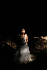Iowa Non-traditioanal alternative tatted bride in moody cave lighting at iowa's state park maquoketa cakes