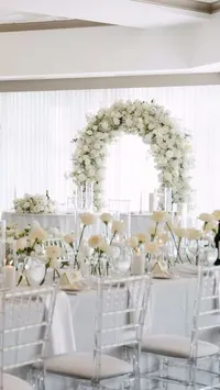 Modern Luxury Baby’s Breath Arch Behind the Sweetheart Table