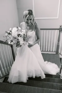 Brideonstairswithbouquet