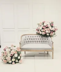 Elegant Mother’s Day photo shoot with dusty rose and white flowers in a romantic studio setting