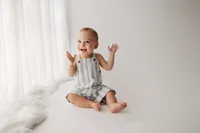 Baby celebrates his first birthday with Cake Smash Pictures at Holy City Babies Portrait Studio in Charleston, SC.