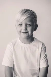 Little boy smiles at the camera during Personality Portrait Photoshoot in Charleston, SC.
