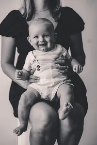Baby smiles at the camera during Personality Photoshoot in Charleston, South Carolina.