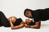 Expectant parents pose for studio Maternity Portraits at Holy City Babies Portrait Studio in Charleston, SC.
