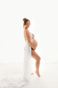 Pregnant mother poses for Fine Art, Editorial Style Studio Maternity Portraits in Charleston, SC.
