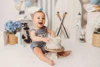 Baby celebrates his first birthday with a Cake Smash Portrait Session at Holy City Babies Portrait Studio in Charleston, SC.
