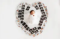 Infant posed for Newborn Baby Photos at Holy City Babies Portrait Studio in Charleston, SC.