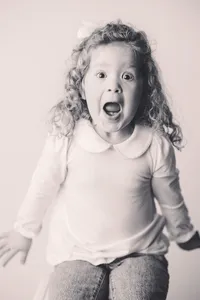 Little girl poses for Personality Portraits at Holy City Babies Portrait Studio in Charleston, South Carolina.