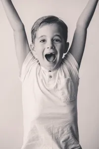 Young boy smiles at the camera during Personality Portrait Photoshoot in Charleston, SC.