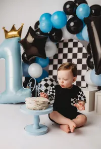 Baby celebrates his first birthday with Cake Smash Pictures at Holy City Babies Portrait Studio in Charleston, SC.