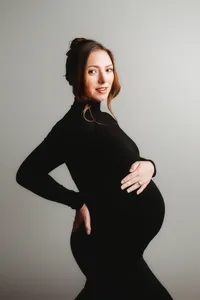 Pregnant mother poses for Fine Art, Editorial Style Studio Maternity Portraits in Charleston, SC.