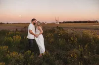 Maternity Photos in Charleston, SC -- Expectant mother poses for Maternity Portraits during Sunset on the Marsh Charleston, SC.