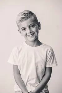 Young boy smiles at the camera during Personality Portrait Photoshoot in Charleston, SC.