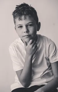Young boy poses for Personality Portraits in Charleston, South Carolina.