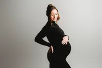 Pregnant woman poses for Studio Maternity Portraits in Charleston, South Carolina.