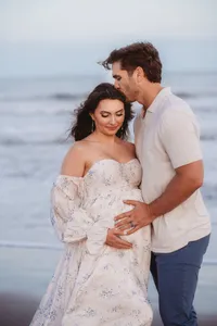 Charleston Beach Maternity Photographer -- Expectant parents pose for Maternity Photos on Folly Beach, SC.