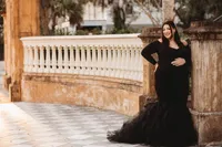 Maternity Photos in Charleston, SC -- Expectant mother poses for Maternity Portraits in downtown Charleston, SC.