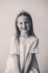 Young girl smiles at the camera during Personality Portrait Session in Charleston, SC.