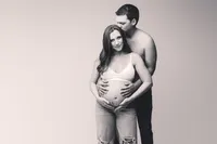 Expectant parents pose for Studio Maternity Portraits at Holy City Babies Portrait Studio in Charleston, SC.
